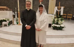 Maren Latham with Fr. Philip Creurer, at her 2018 baptism. Courtesy of Maren Latham.